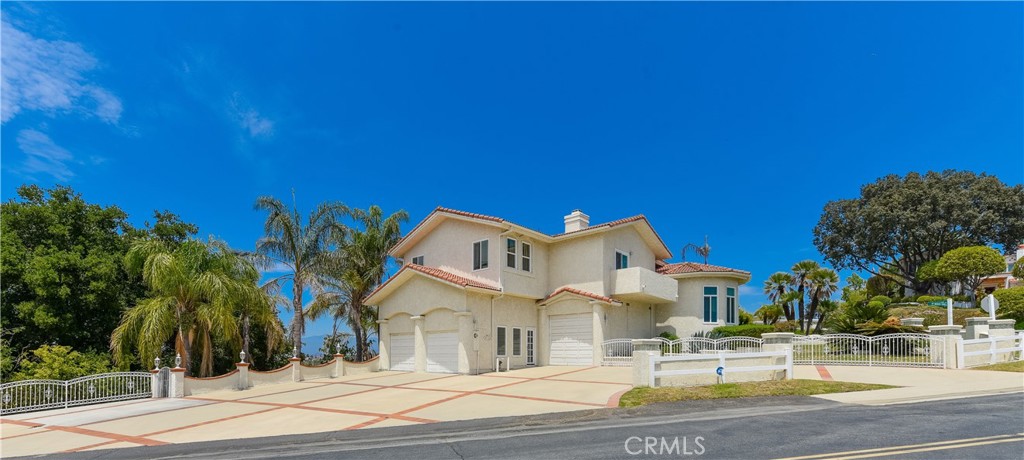 22413 Ridge Line Road Diamond Bar, CA 91765 - Photo 1 of 1 a view of a building with a yard and palm trees
