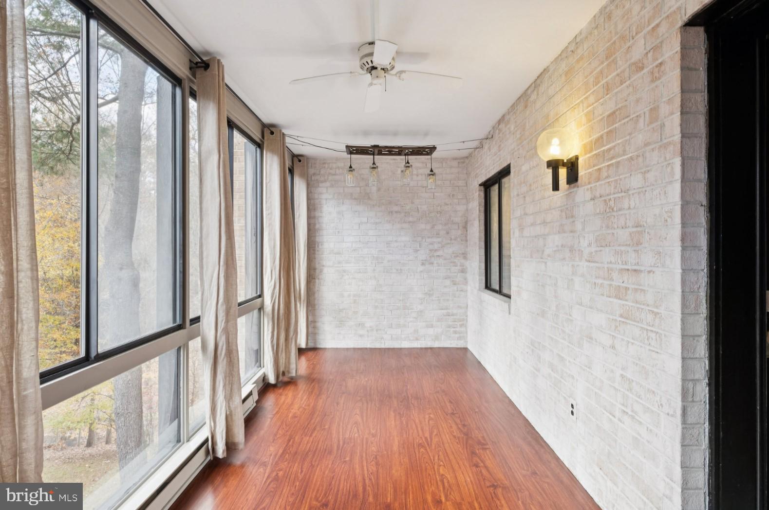 520 North Lemon Street, Unit E8 Media, PA 19063 - Photo 7 of 17 a view of a hallway with wooden floor and staircase