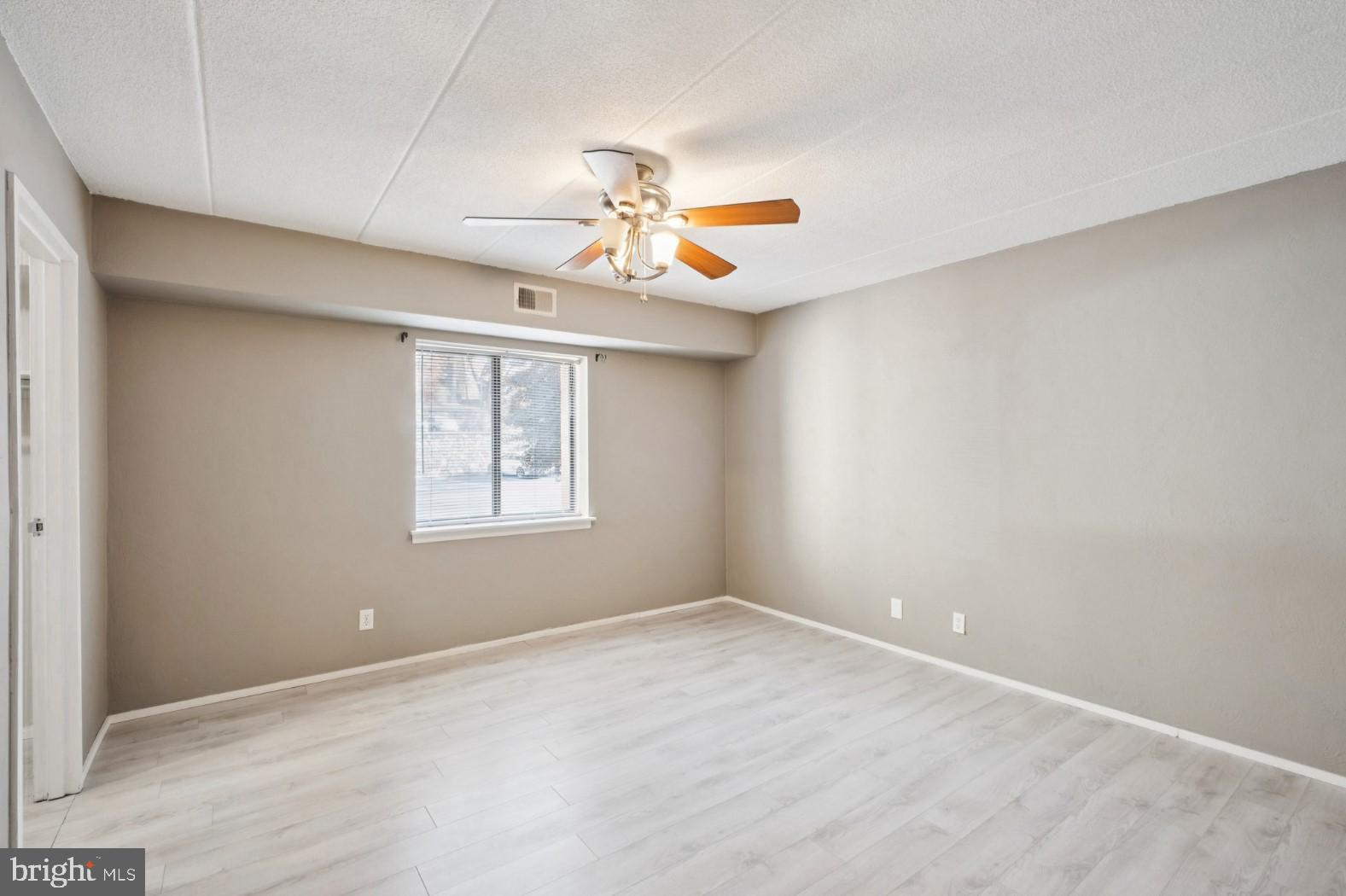 520 North Lemon Street, Unit E8 Media, PA 19063 - Photo 8 of 17 wooden floor in an empty room with a window