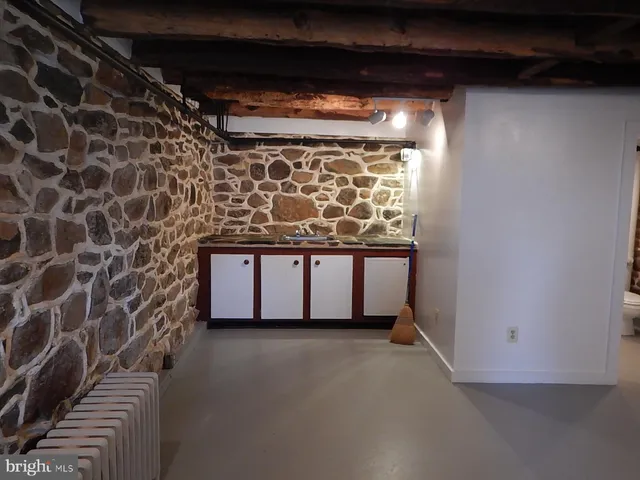 a bathroom with a toilet and a shower curtain