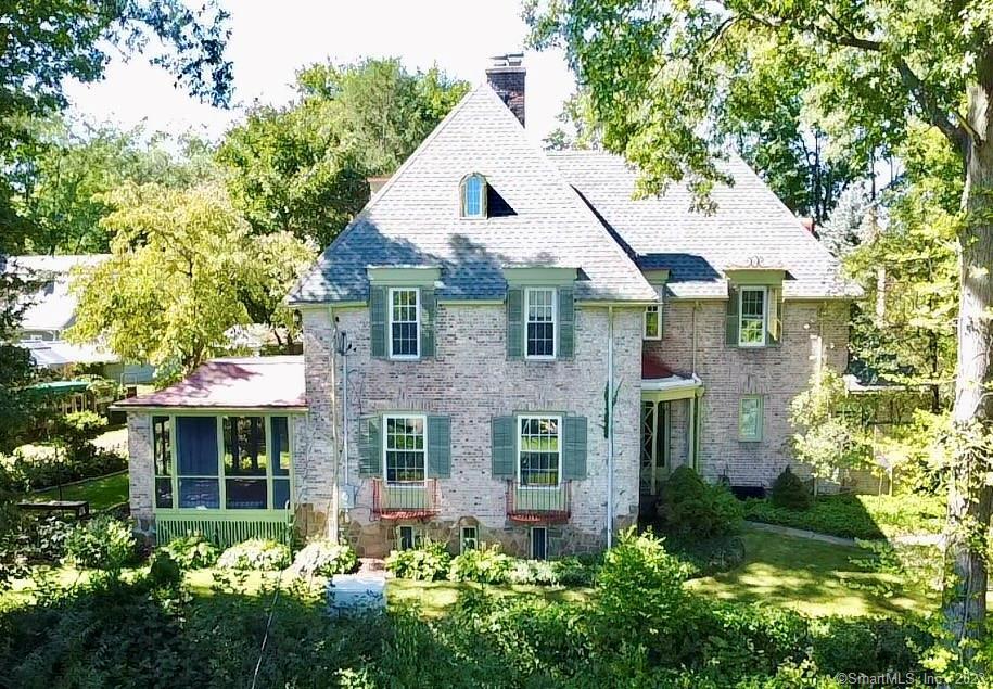 119 10 Acre Road New Britain, CT 06052 - Photo 1 of 1 a view of a house with brick walls and plants