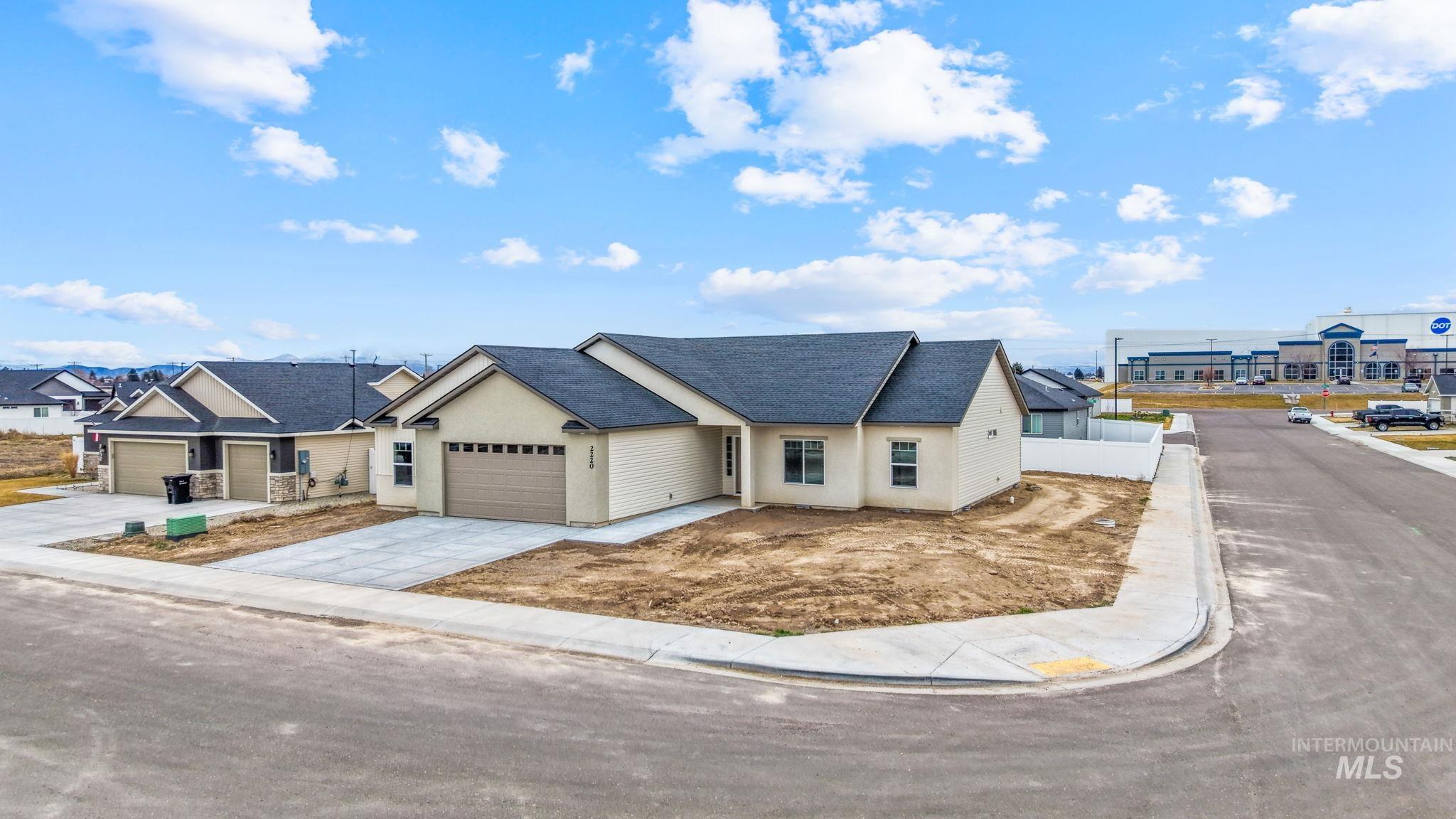 2220 Great Basin Way Burley, ID 83318 - Photo 4 of 39 Ranch-style home with driveway, a shingled roof, stucco siding, and an attached garage