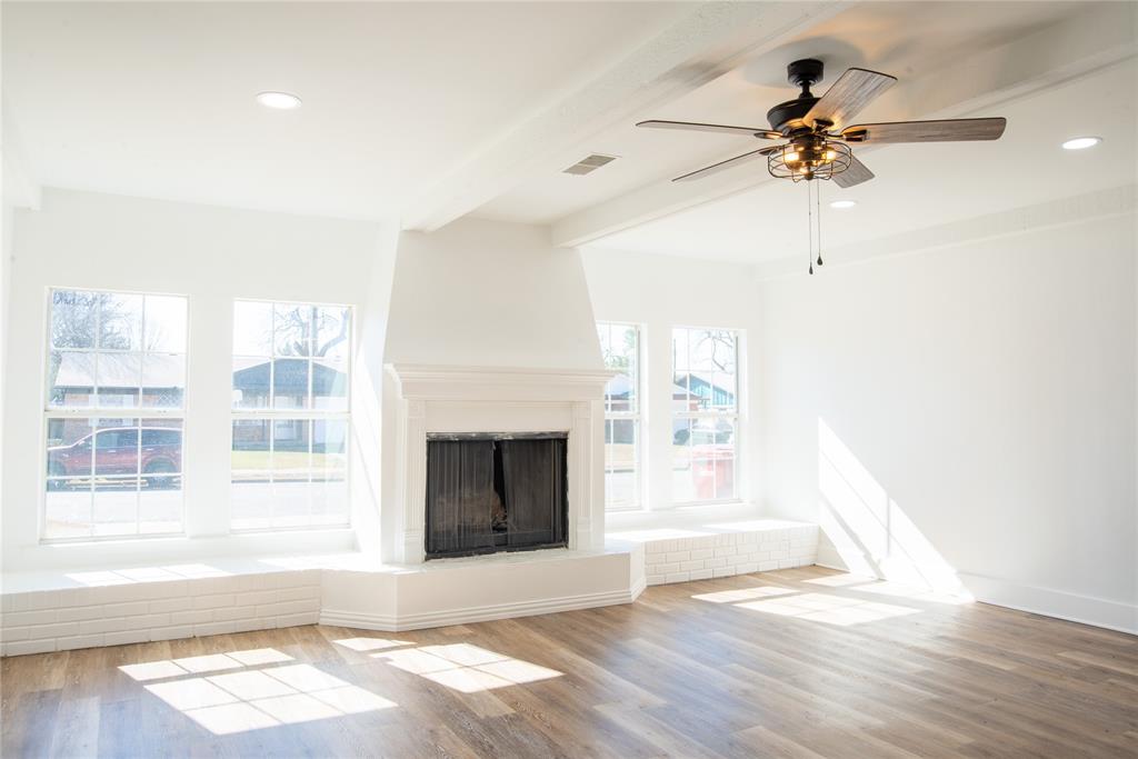 1805 Belden Street Sherman, TX 75092 - Photo 6 of 16 a view of an empty room with a window and fireplace