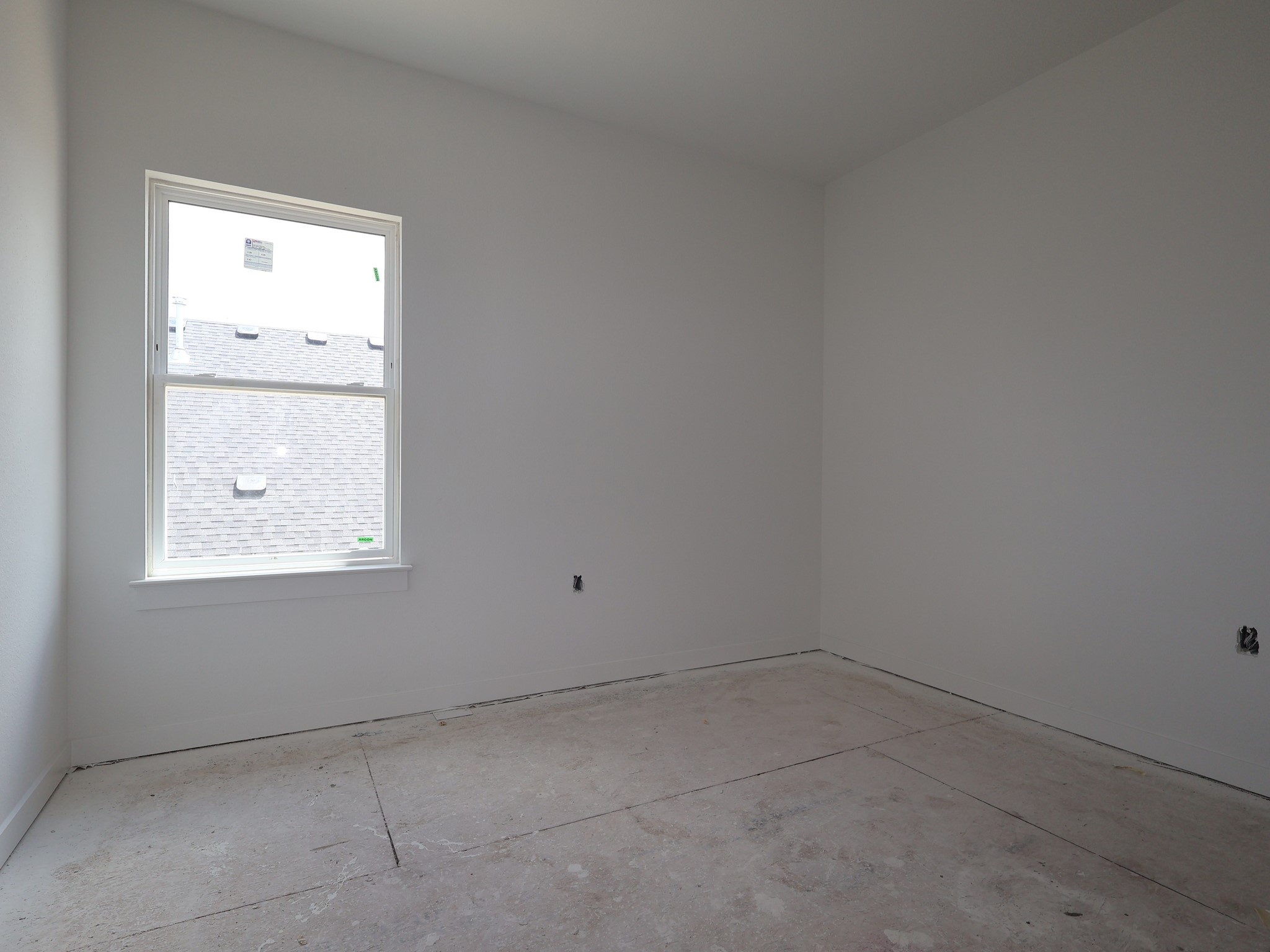 261 Callahan Loop Buda, TX 78610 - Photo 12 of 19 an empty room with a window
