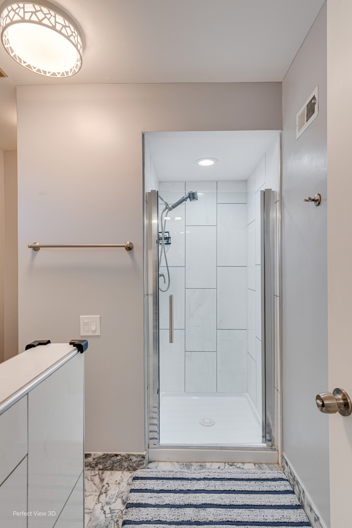 3811 Mission Hills Road Northbrook, IL 60062 - Photo 20 of 26 a bathroom with a shower