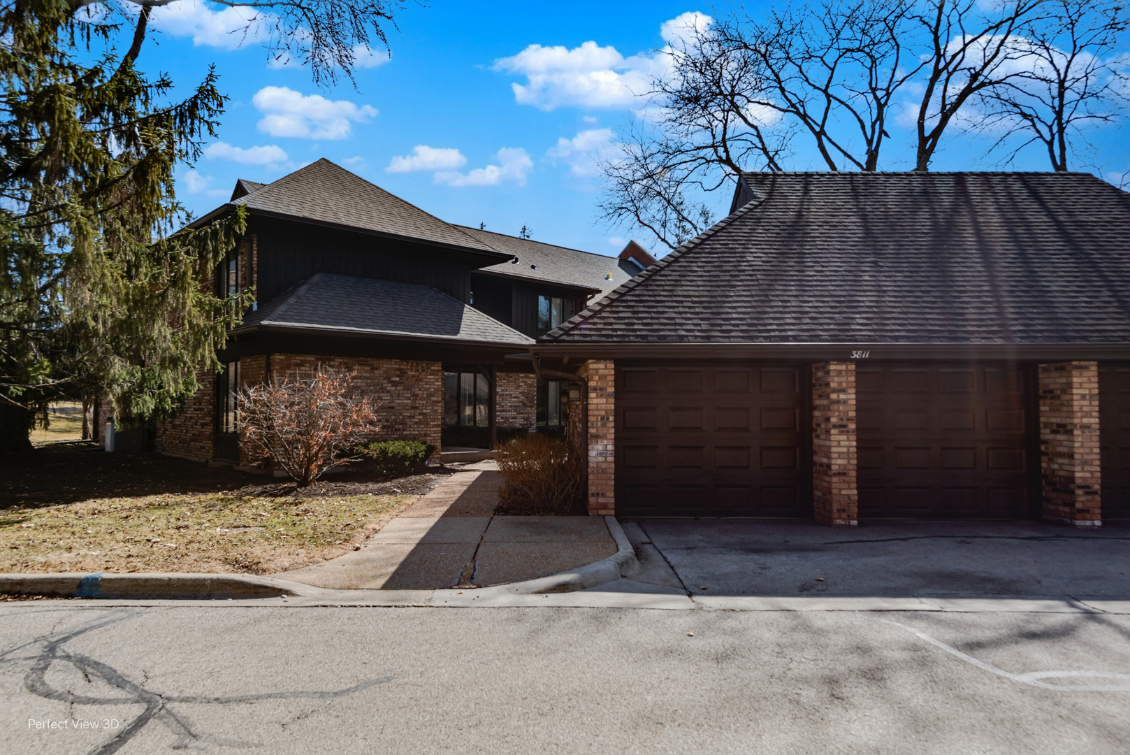 3811 Mission Hills Road Northbrook, IL 60062 - Photo 2 of 26 a front view of a house with a yard