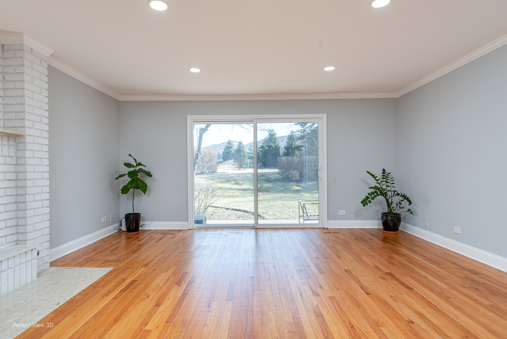 3811 Mission Hills Road Northbrook, IL 60062 - Photo 4 of 26 a view of a room with wooden floor and a potted plant