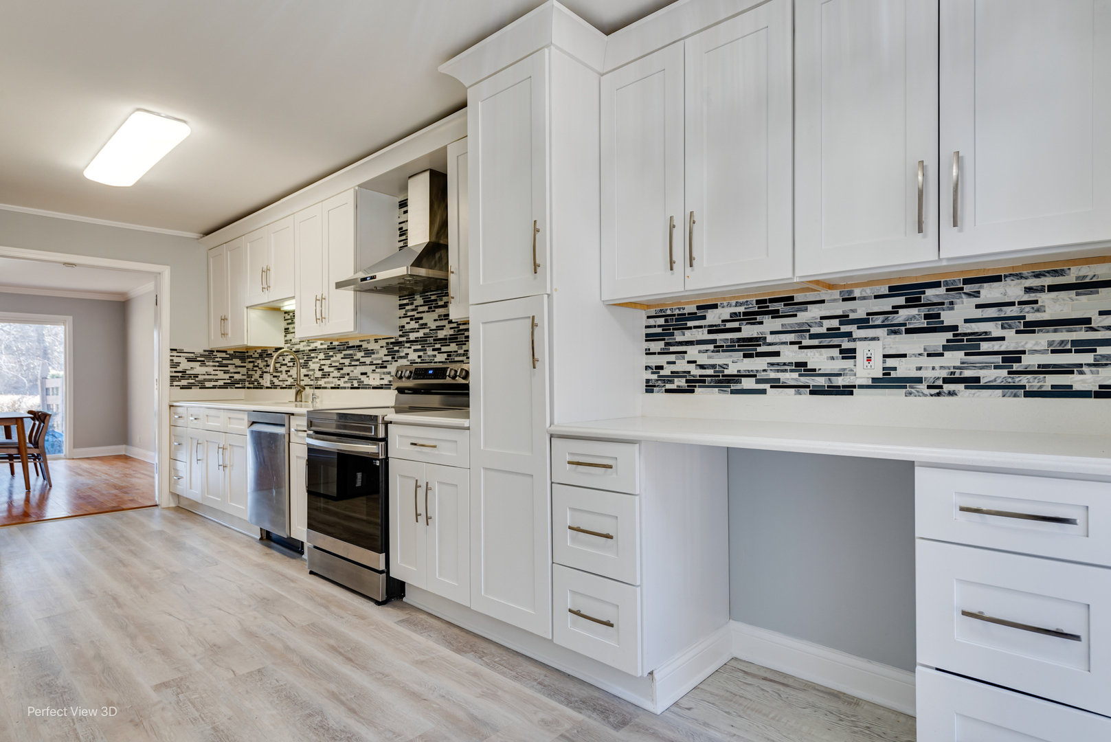 3811 Mission Hills Road Northbrook, IL 60062 - Photo 8 of 26 a kitchen with white cabinets and appliances