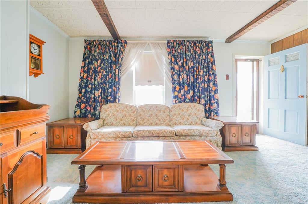 6304 Tuscarawas Road Midland, PA 15059 - Photo 17 of 49 a bedroom with a bed and a window