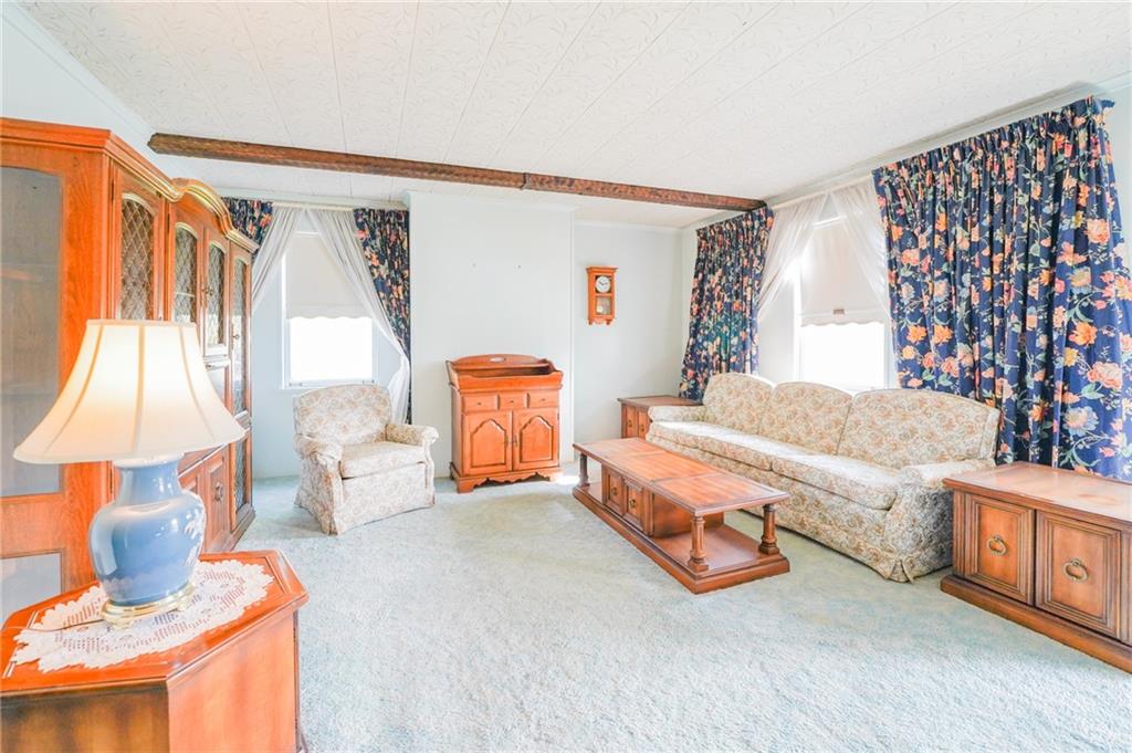 6304 Tuscarawas Road Midland, PA 15059 - Photo 19 of 49 a bedroom with furniture and a large window