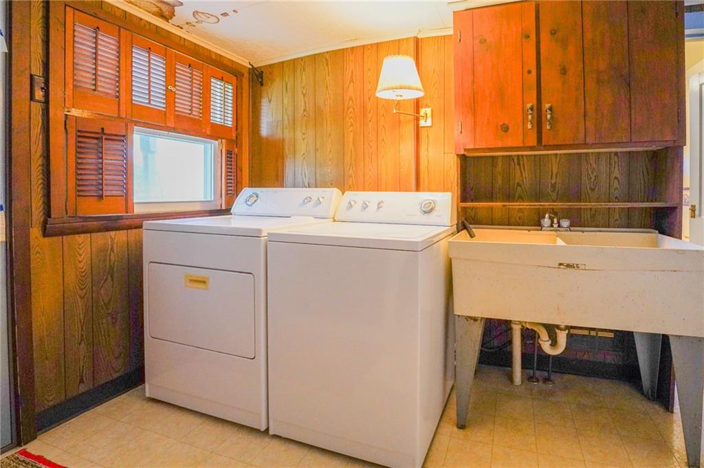 6304 Tuscarawas Road Midland, PA 15059 - Photo 26 of 49 a utility room with dryer and washer