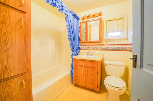 a bedroom with a large bed and a large window