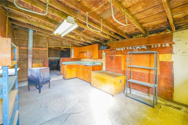 a view of backyard of house with green space