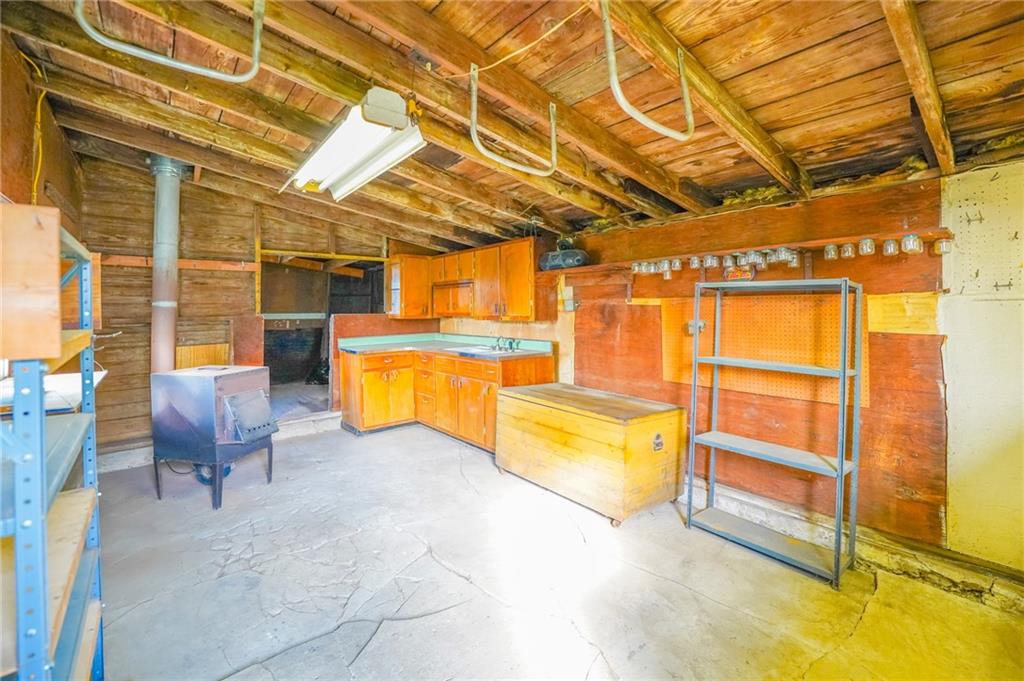 6304 Tuscarawas Road Midland, PA 15059 - Photo 37 of 49 a view of an empty room with a lounge chair