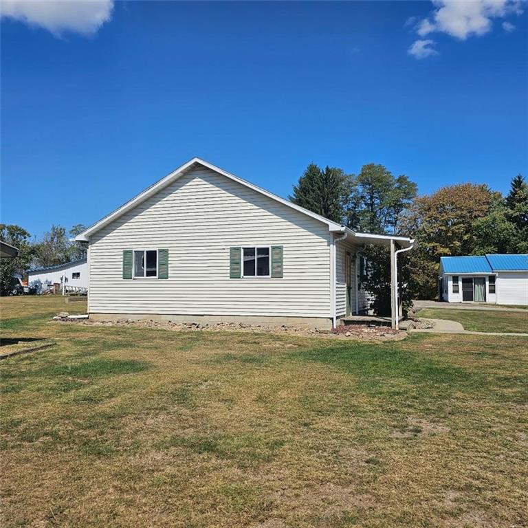 6304 Tuscarawas Road Midland, PA 15059 - Photo 41 of 49 a view of a house with a yard