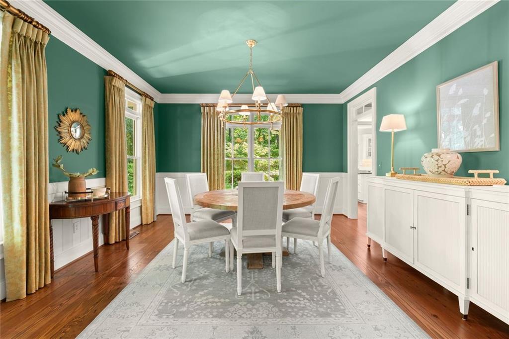 1450 Acworth Due West Road Northwest Kennesaw, GA 30152 - Photo 8 of 77 a dining room with furniture a chandelier and wooden floor