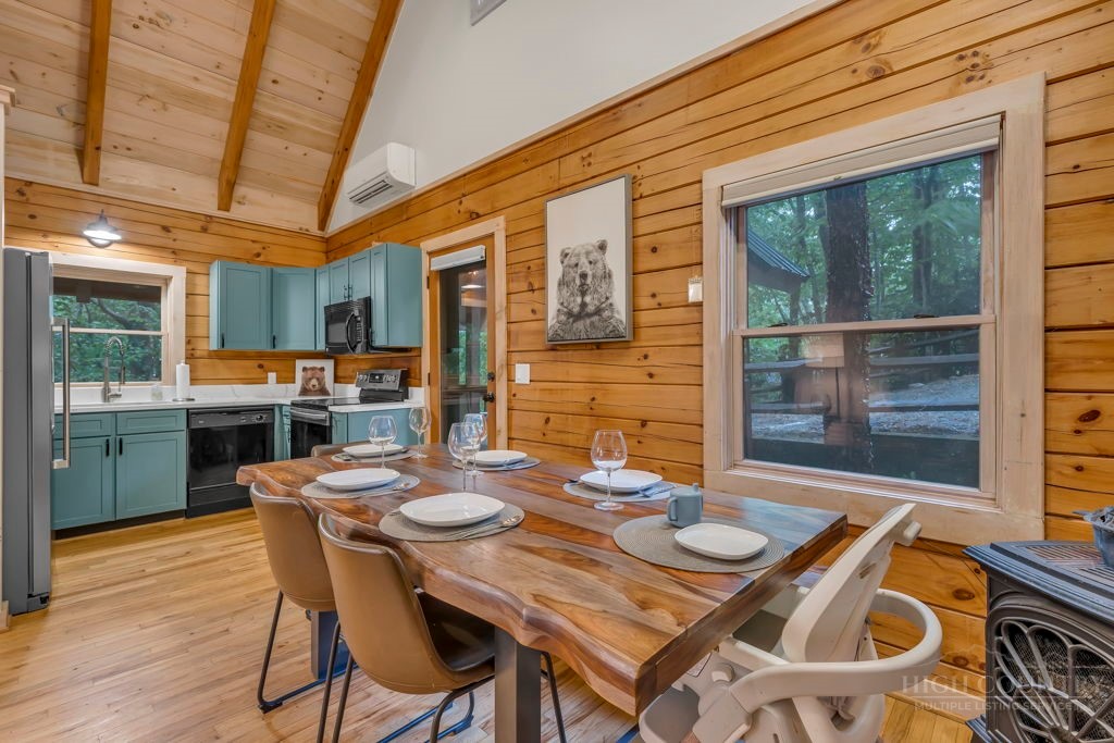 192 Dewitt Barnett Road Vilas, NC 28692 - Photo 7 of 32 a dining room with furniture and wooden floor