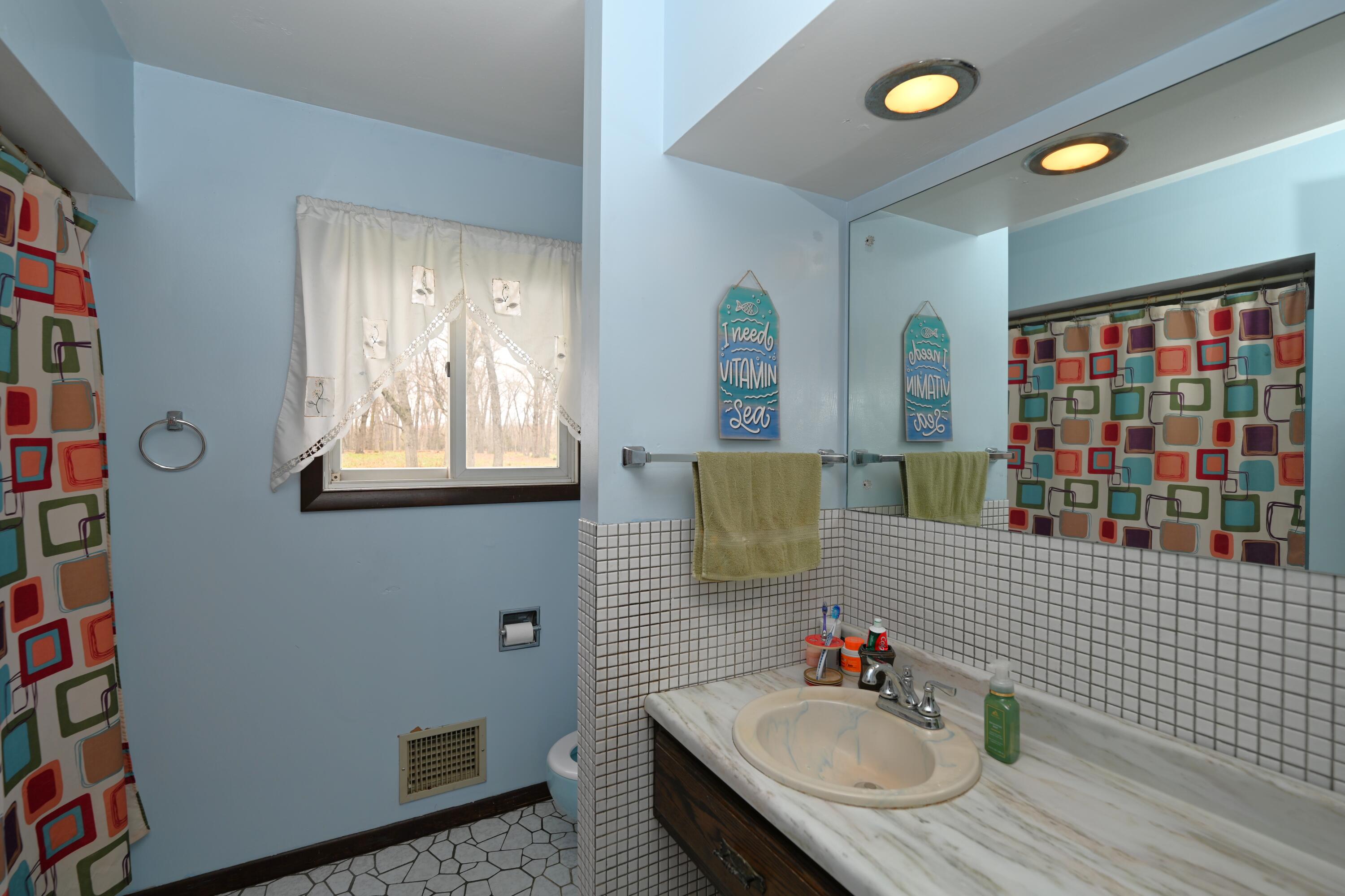 5110 West 400 North Winamac, IN 46996 - Photo 24 of 35 a bathroom with a sink toilet and shower