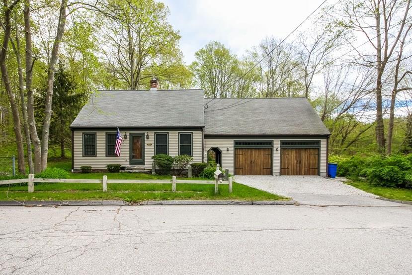 243 Old Clinton Road Westbrook, CT 06498 - Photo 1 of 1 a front view of a house with a yard and potted plants