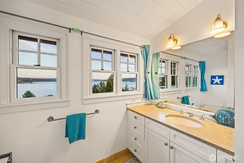 a bathroom with a sink and a large mirror