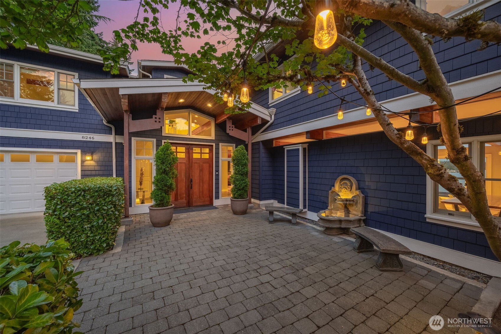 8246 East Mercer Way Mercer Island, WA 98040 - Photo 2 of 39 a view of a house with a chairs and table in a patio