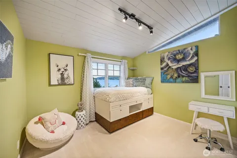 a living room with a bed and furniture