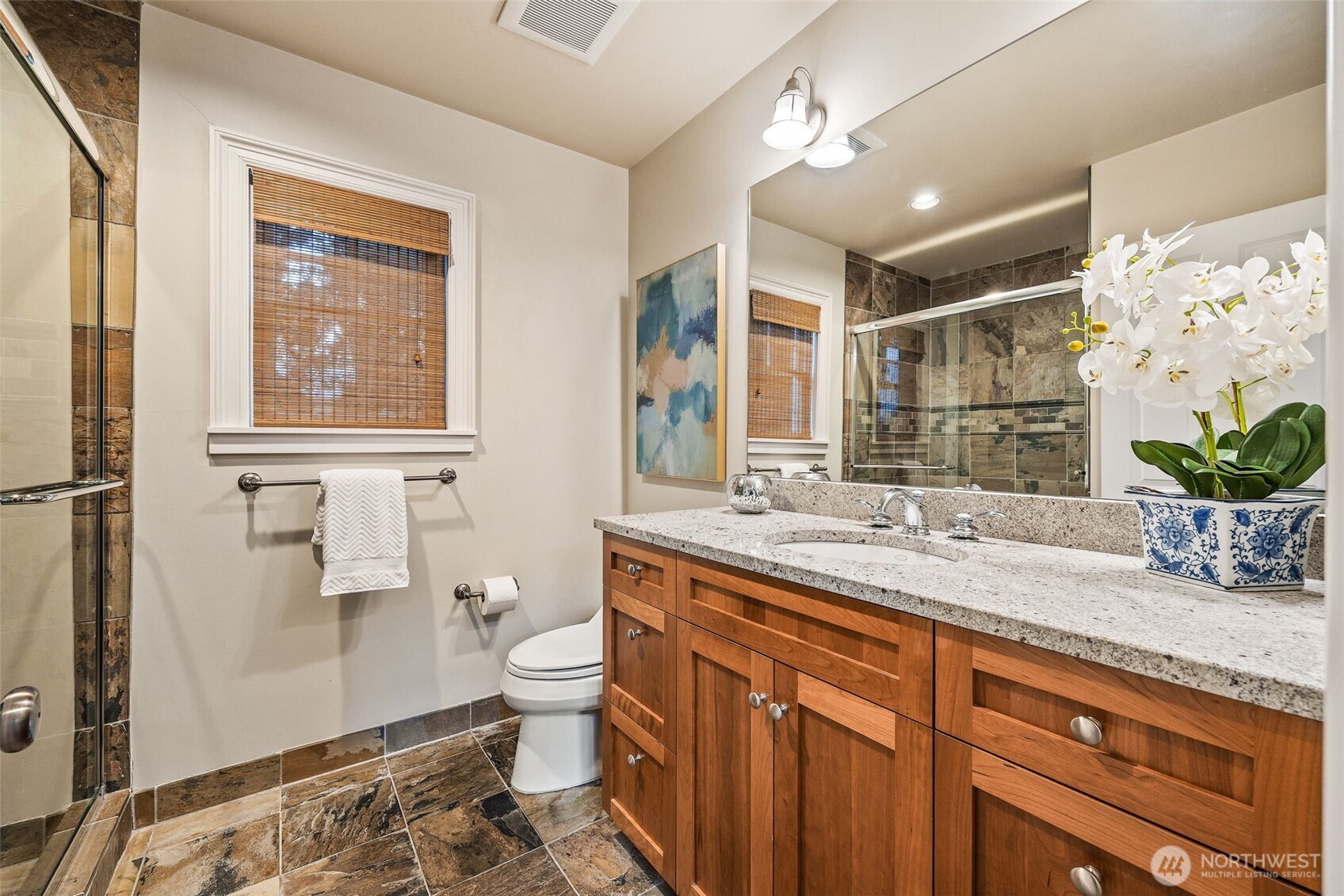 8246 East Mercer Way Mercer Island, WA 98040 - Photo 28 of 39 a bathroom with a granite countertop sink mirror vanity and toilet