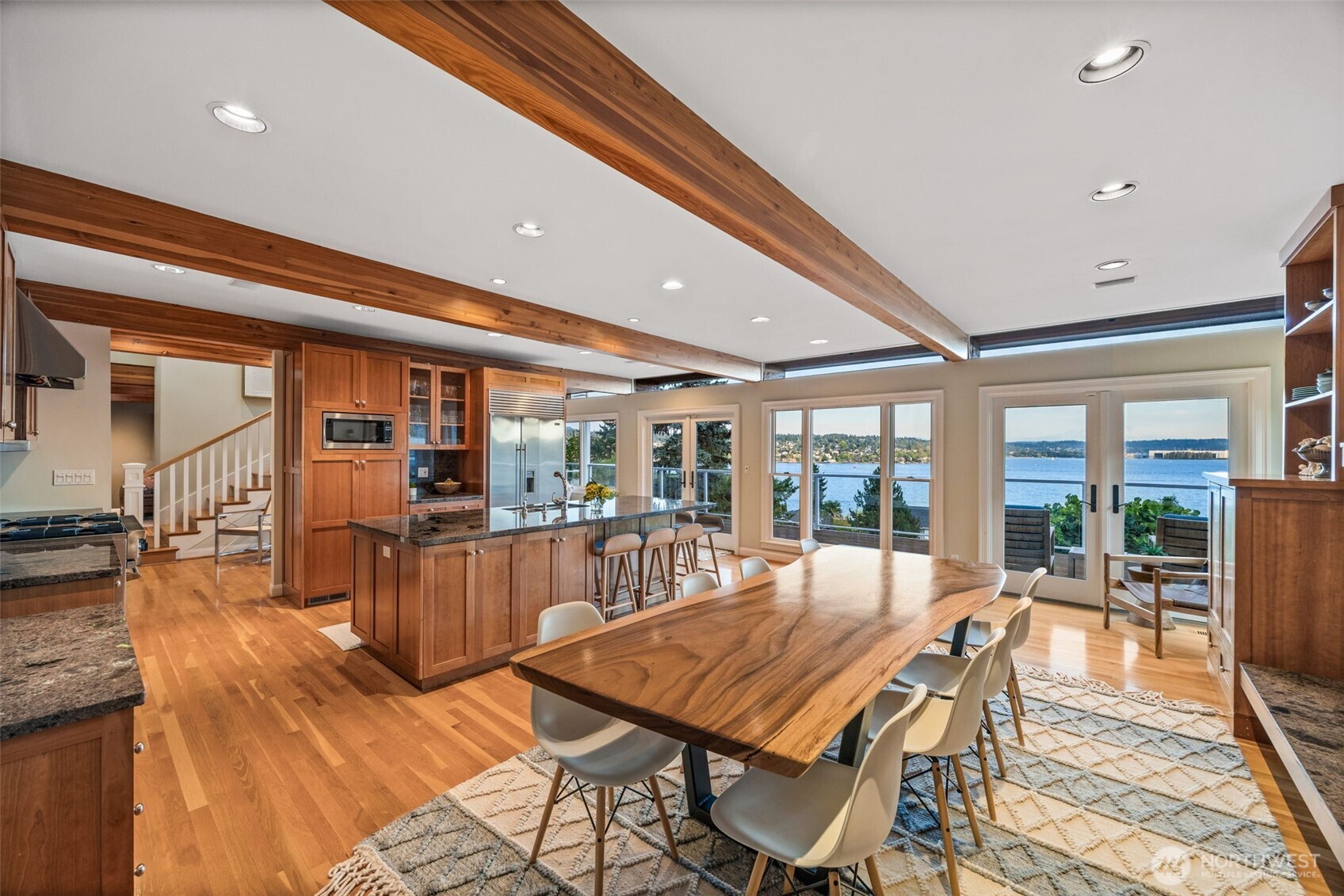 8246 East Mercer Way Mercer Island, WA 98040 - Photo 6 of 39 a dining room with furniture large windows and wooden floor