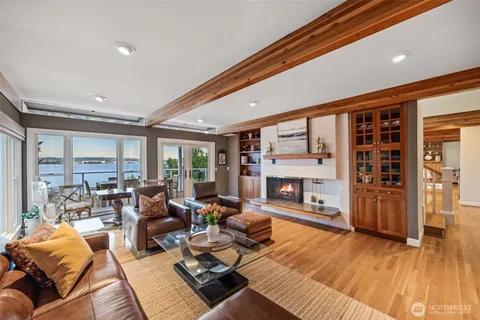 a living room with furniture large window and outer view