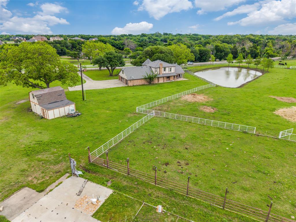 342 East Tripp Road Sunnyvale, TX 75182 - Photo 3 of 5 a view of a swimming pool with a garden