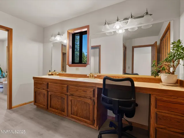 a bathroom with a sink double vanity and a mirror