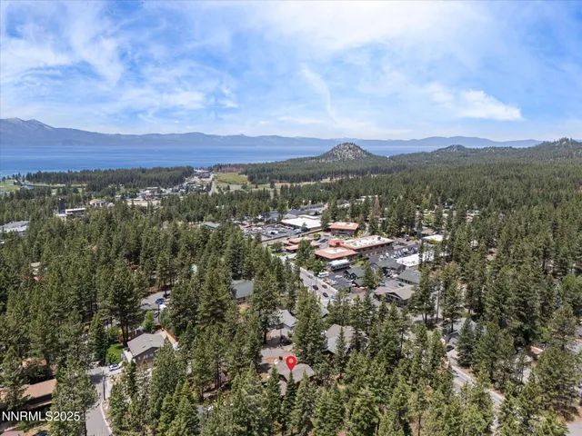 a wooden bench sitting in the middle of a yard