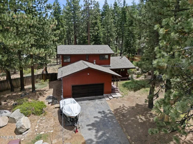 a living room with furniture a fireplace and a table