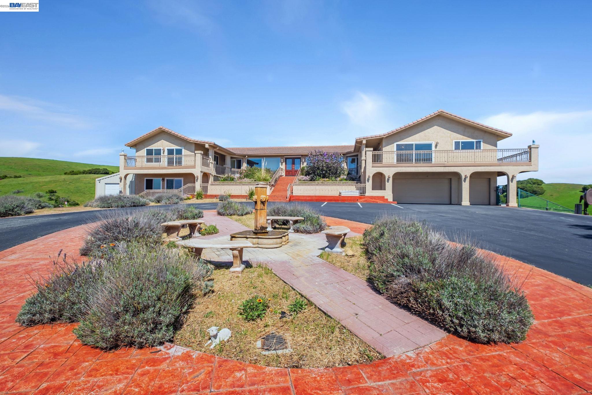 41794 Vargas Road Fremont, CA 94539 - Photo 11 of 60 a front view of a house with a yard