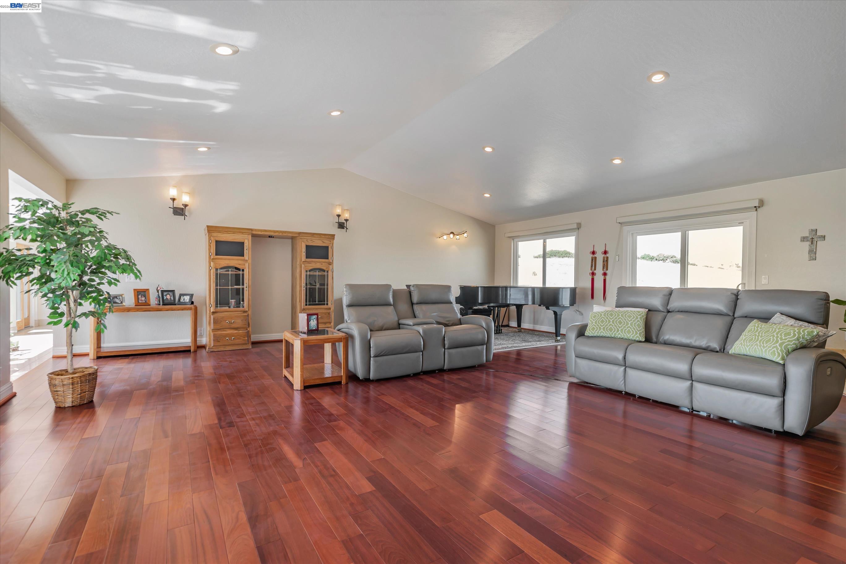 41794 Vargas Road Fremont, CA 94539 - Photo 16 of 60 a living room with furniture and a wooden floor