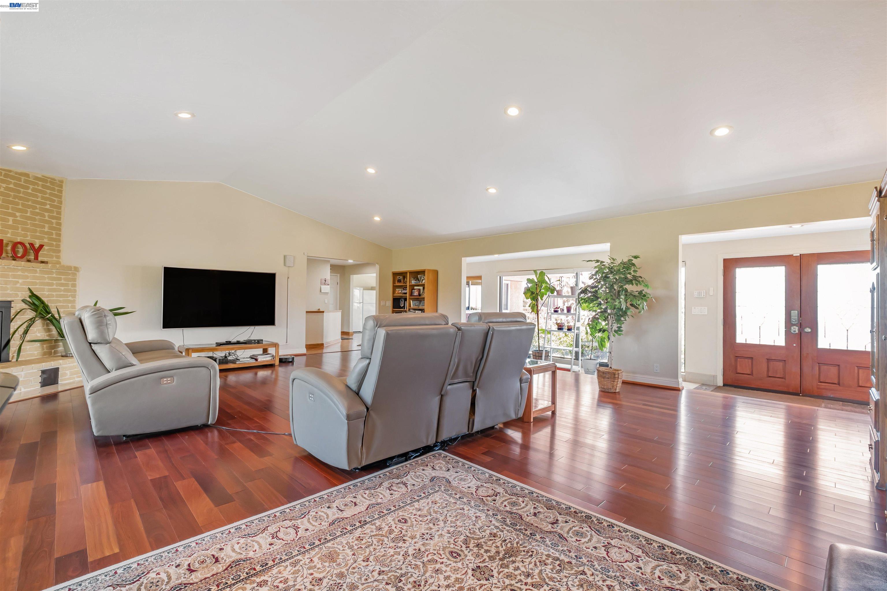41794 Vargas Road Fremont, CA 94539 - Photo 19 of 60 a living room with furniture flat screen tv and wooden floor