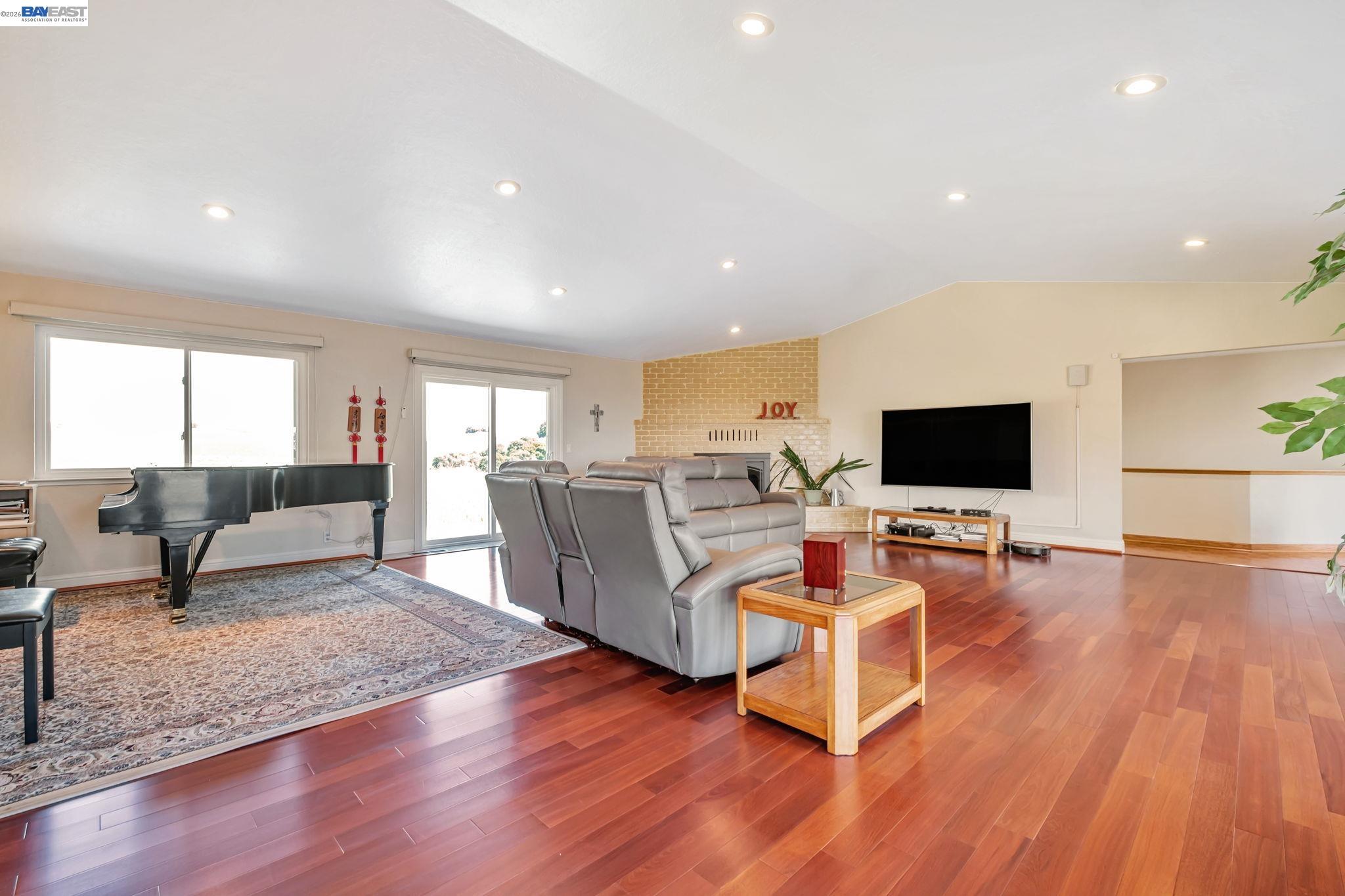 41794 Vargas Road Fremont, CA 94539 - Photo 20 of 60 a living room with furniture and a flat screen tv