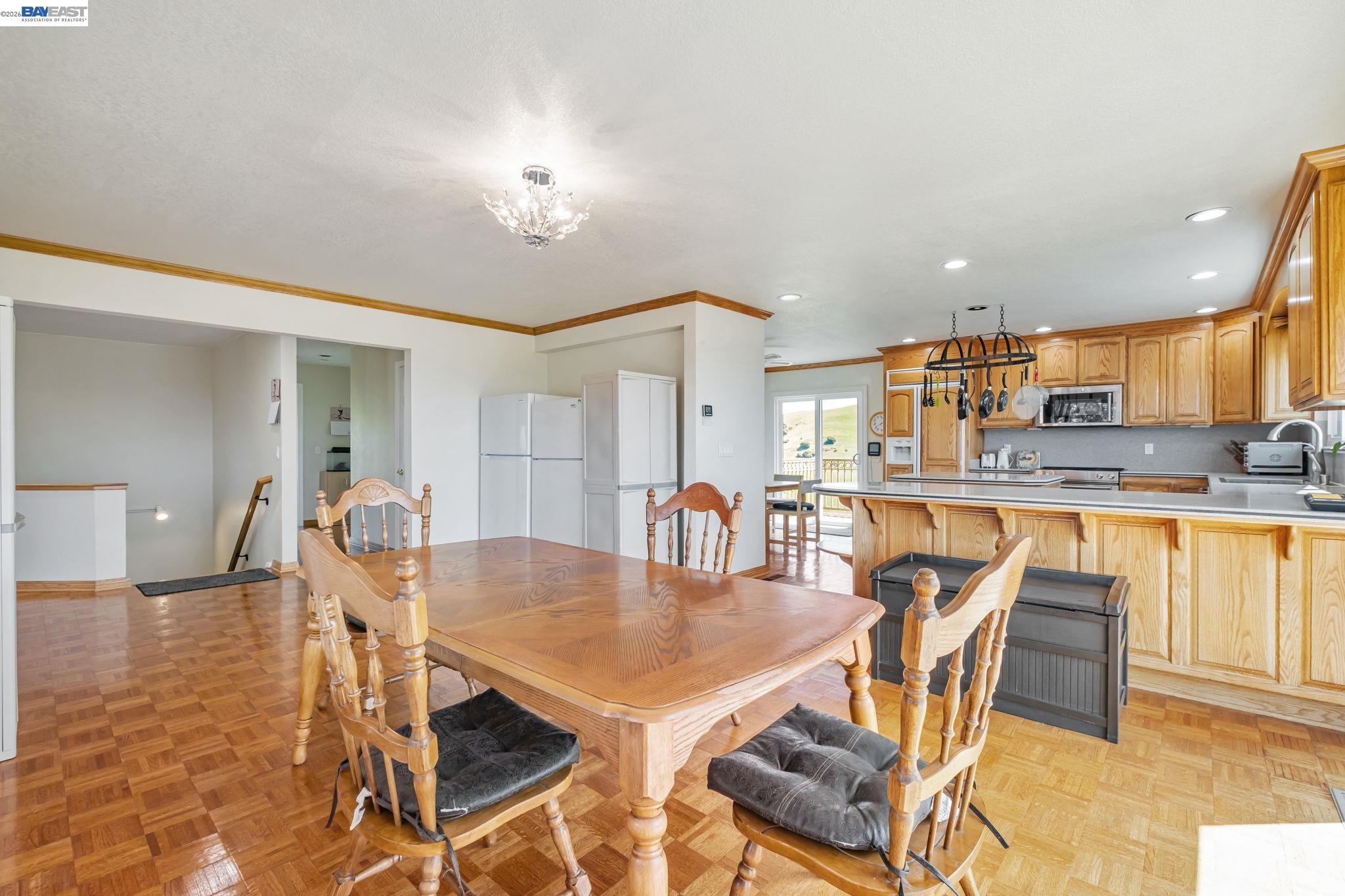 41794 Vargas Road Fremont, CA 94539 - Photo 25 of 60 a view of a dining room with furniture and wooden floor