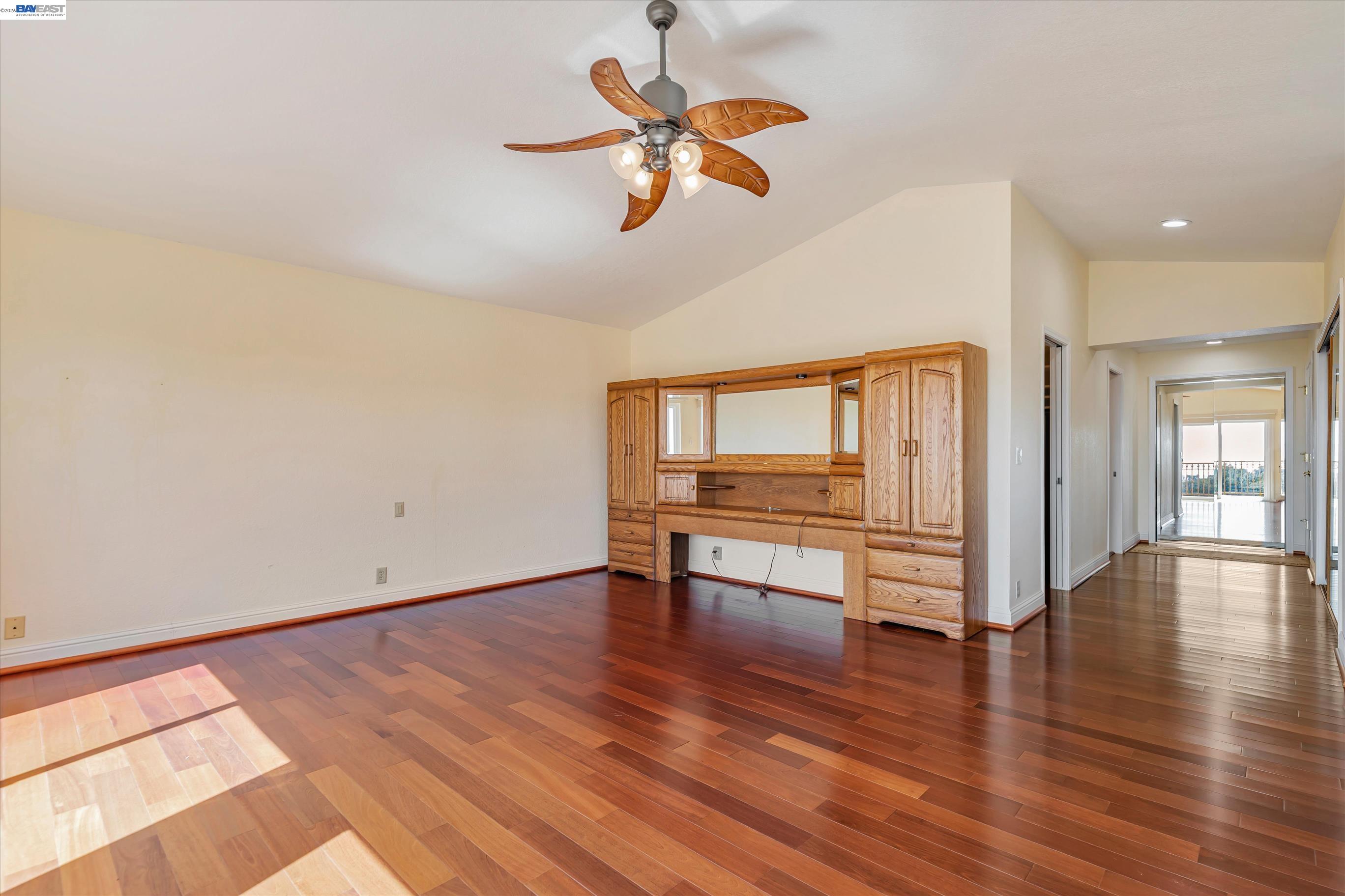 41794 Vargas Road Fremont, CA 94539 - Photo 33 of 60 a view of an empty room with wooden floor and a ceiling fan