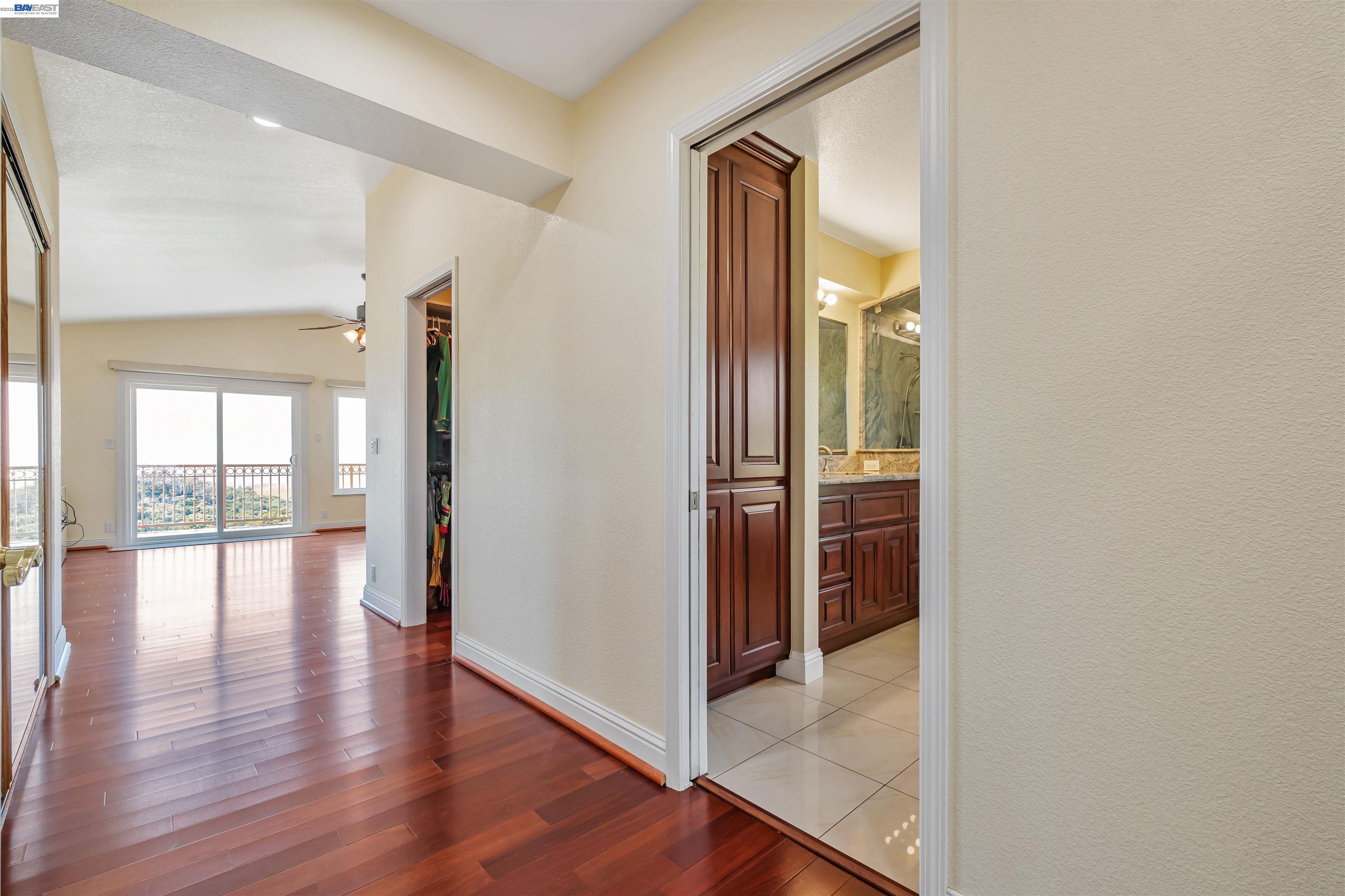 41794 Vargas Road Fremont, CA 94539 - Photo 38 of 60 a view of a hallway with wooden floor and glass door