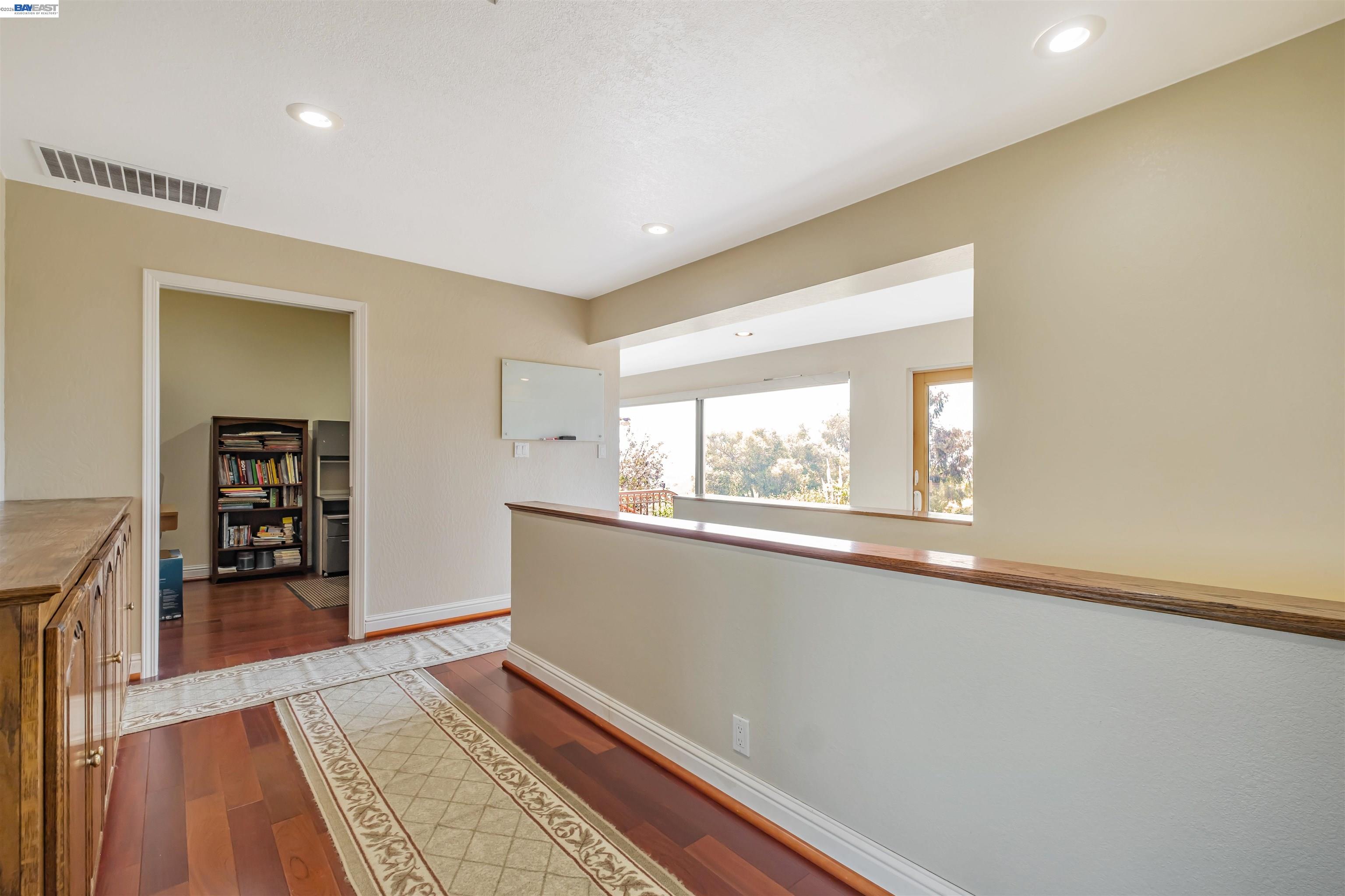 41794 Vargas Road Fremont, CA 94539 - Photo 39 of 60 a view of an empty room with wooden floor and a window