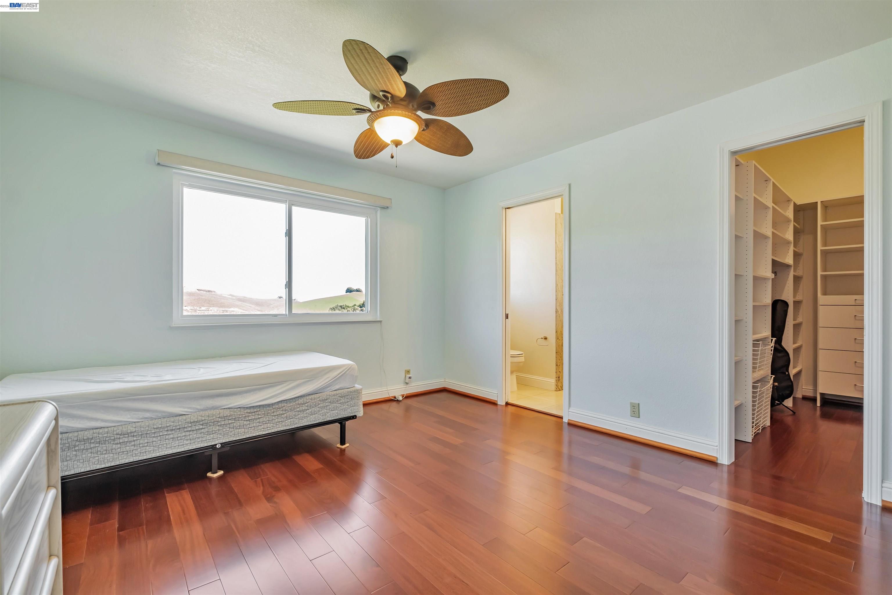 41794 Vargas Road Fremont, CA 94539 - Photo 40 of 60 a bedroom with a bed and a chandelier