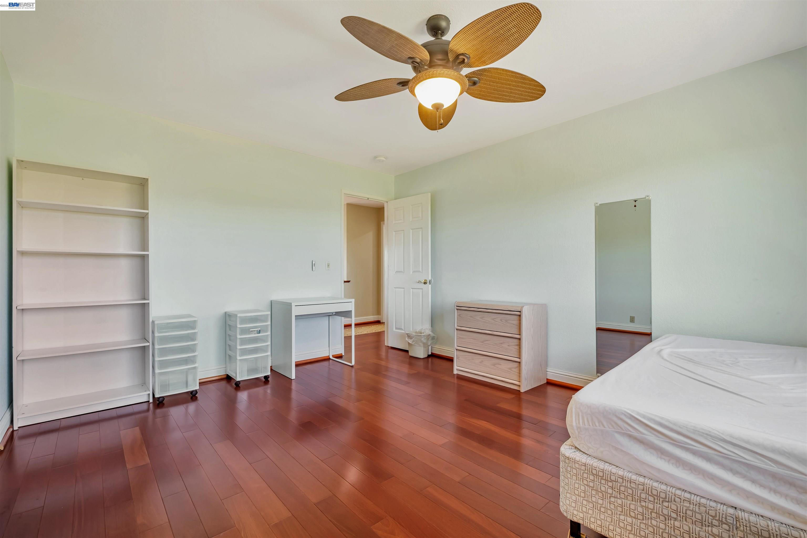 41794 Vargas Road Fremont, CA 94539 - Photo 41 of 60 a bedroom with a bed and a chandelier