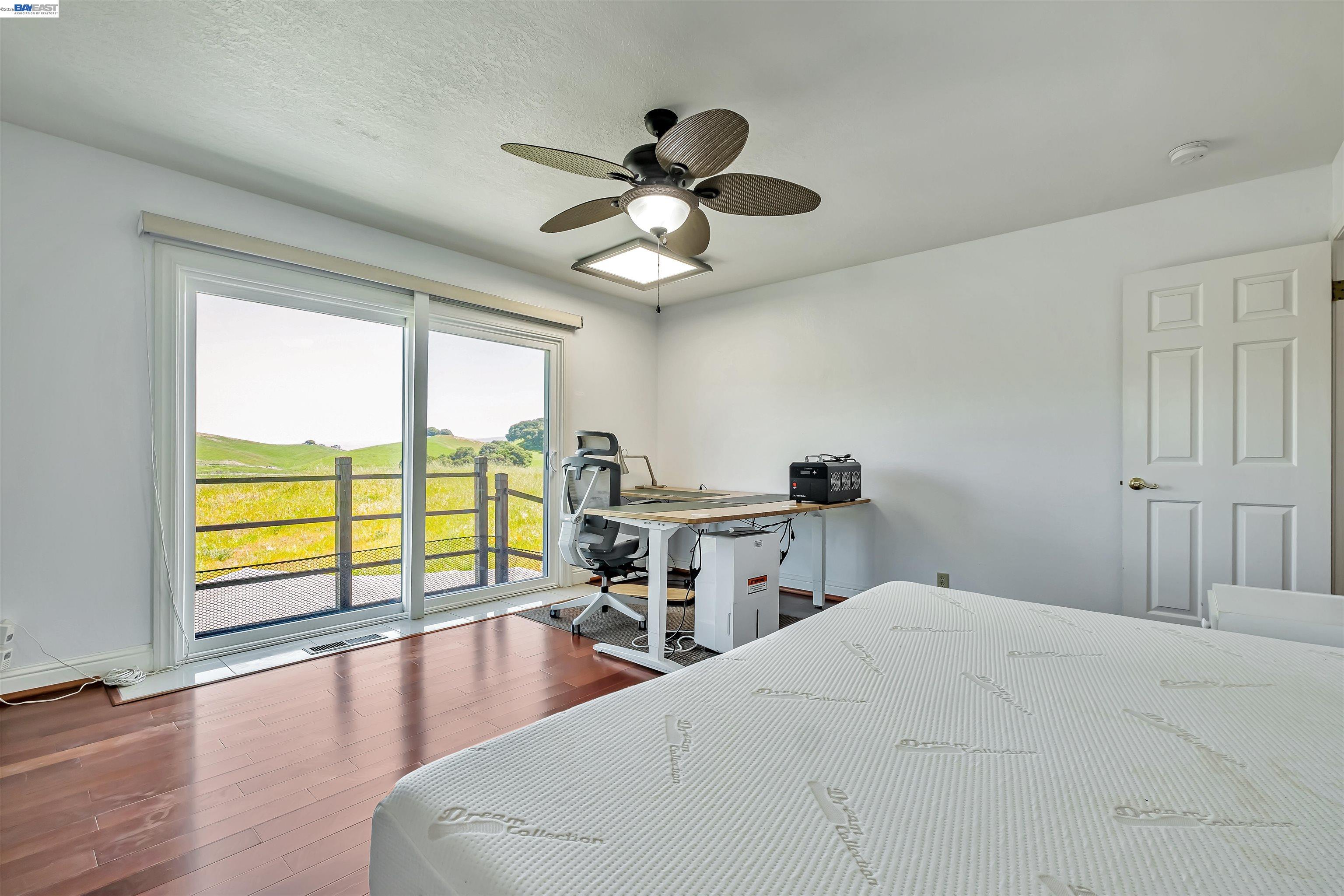 41794 Vargas Road Fremont, CA 94539 - Photo 45 of 60 a bedroom with a large bed and a large window