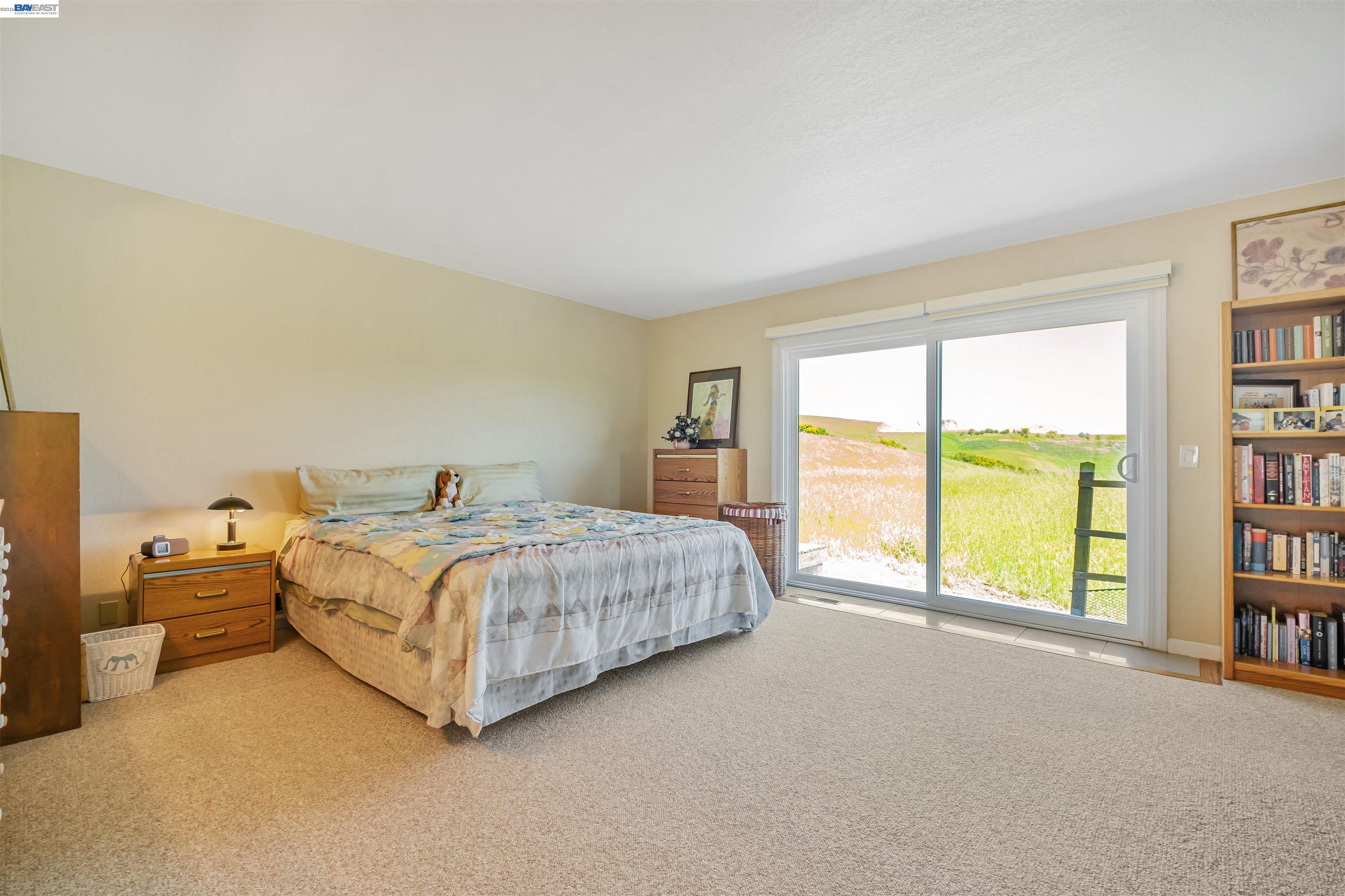 41794 Vargas Road Fremont, CA 94539 - Photo 49 of 60 a spacious bedroom with a bed and a large window