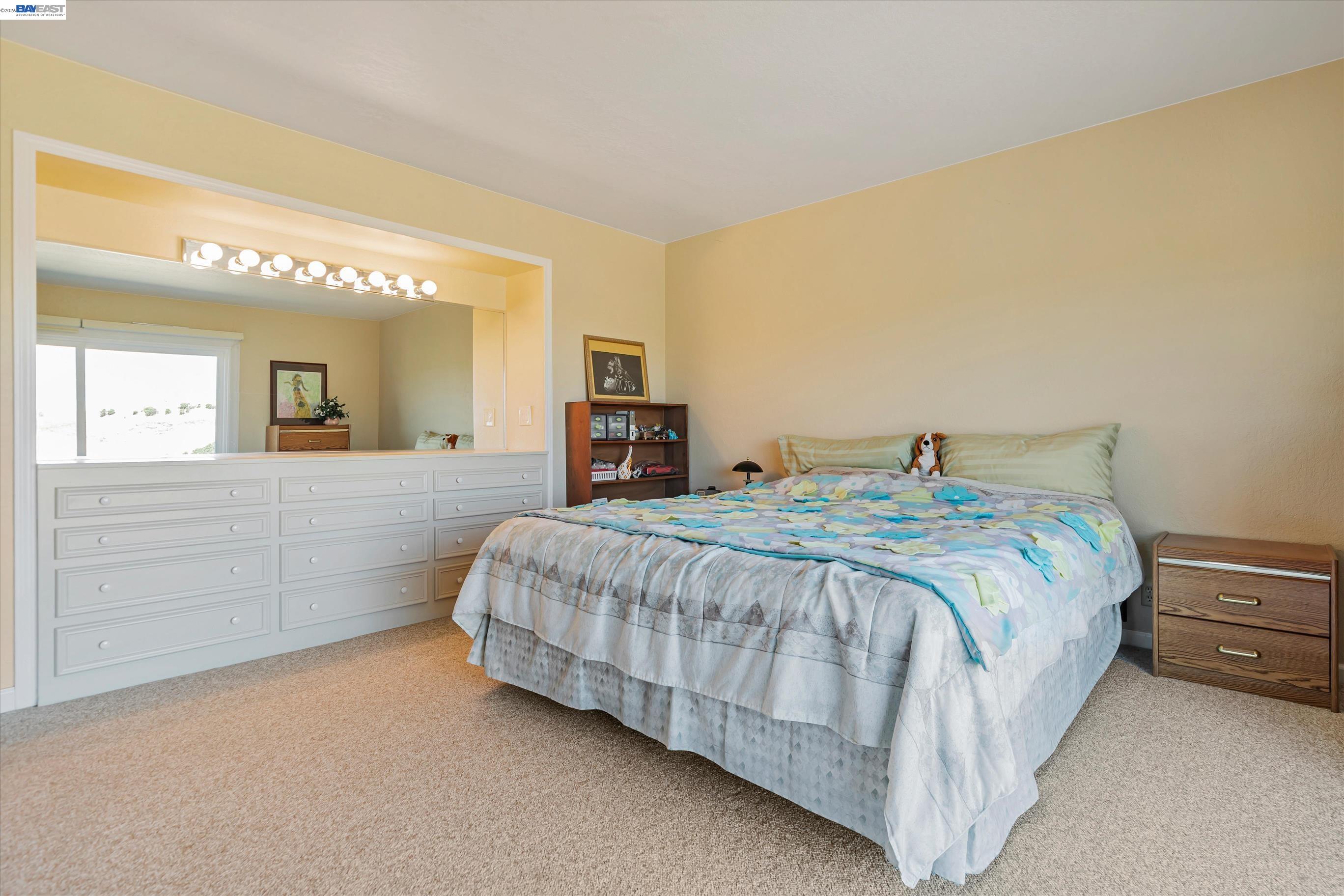 41794 Vargas Road Fremont, CA 94539 - Photo 50 of 60 a spacious bedroom with a bed and a dresser