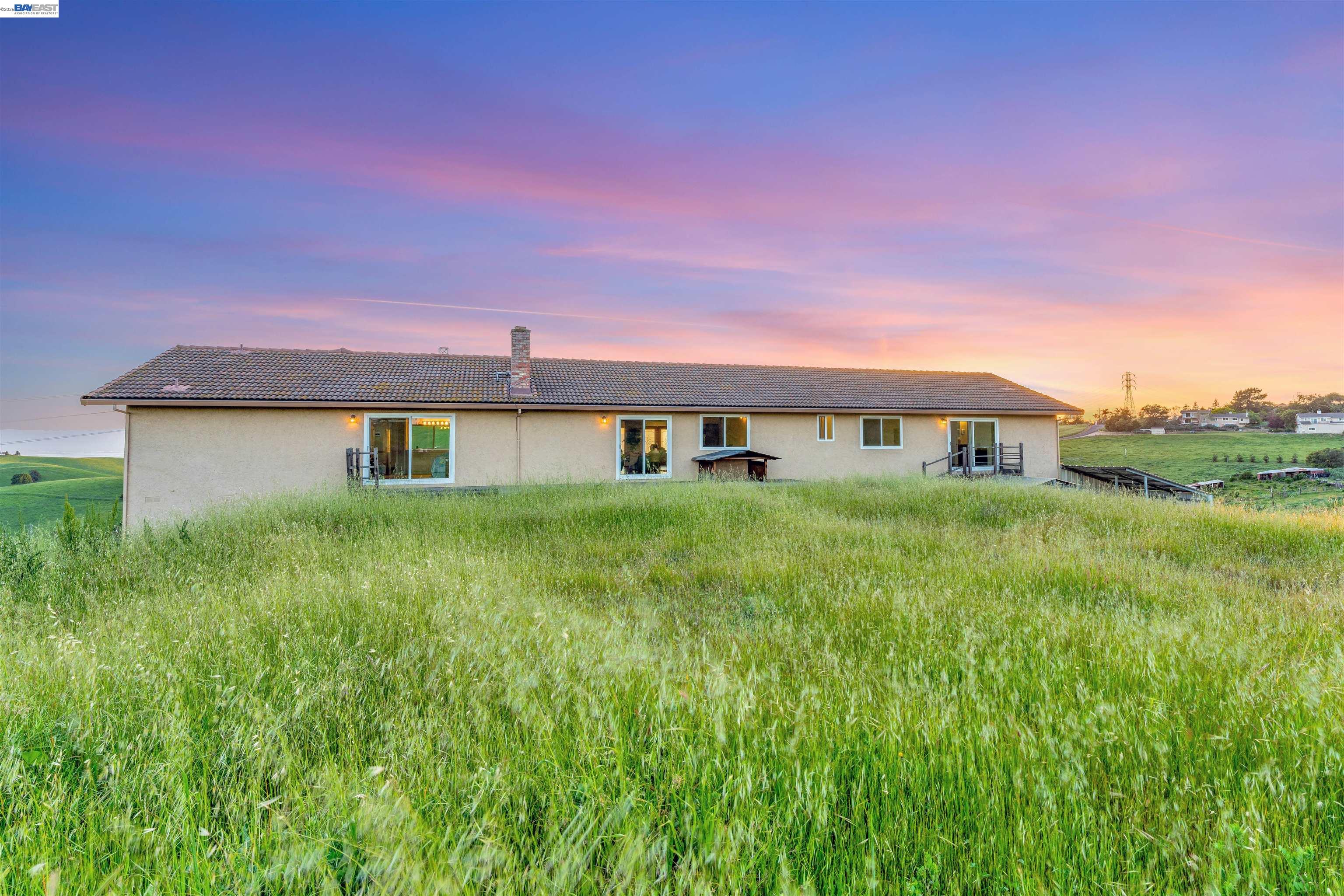 41794 Vargas Road Fremont, CA 94539 - Photo 7 of 60 a front view of a house with a yard