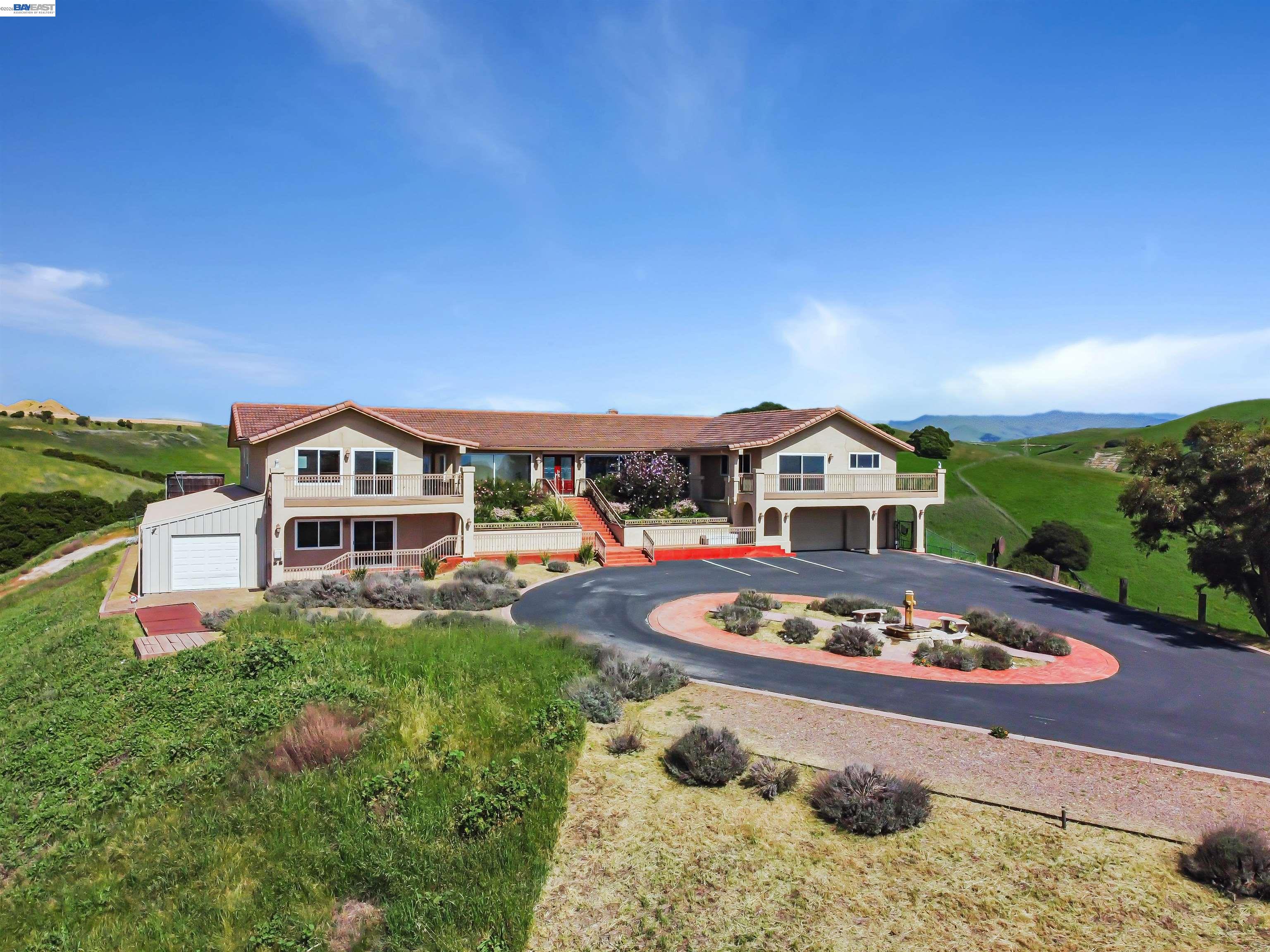 41794 Vargas Road Fremont, CA 94539 - Photo 10 of 60 a front view of a house with a yard
