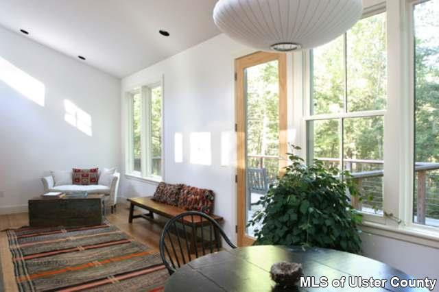 95 Woodland Road, Unit 3 PARCELS Stone Ridge, NY 12484 - Photo 3 of 4 a living room with furniture and a potted plant