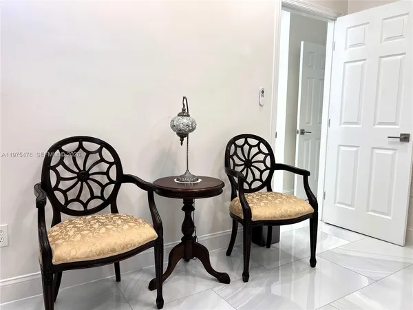 a view of a chairs and a table in the room